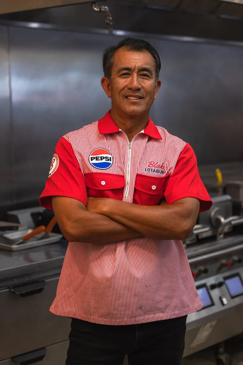 Blake’s Lotaburger: Arms crossed, in the kitchen